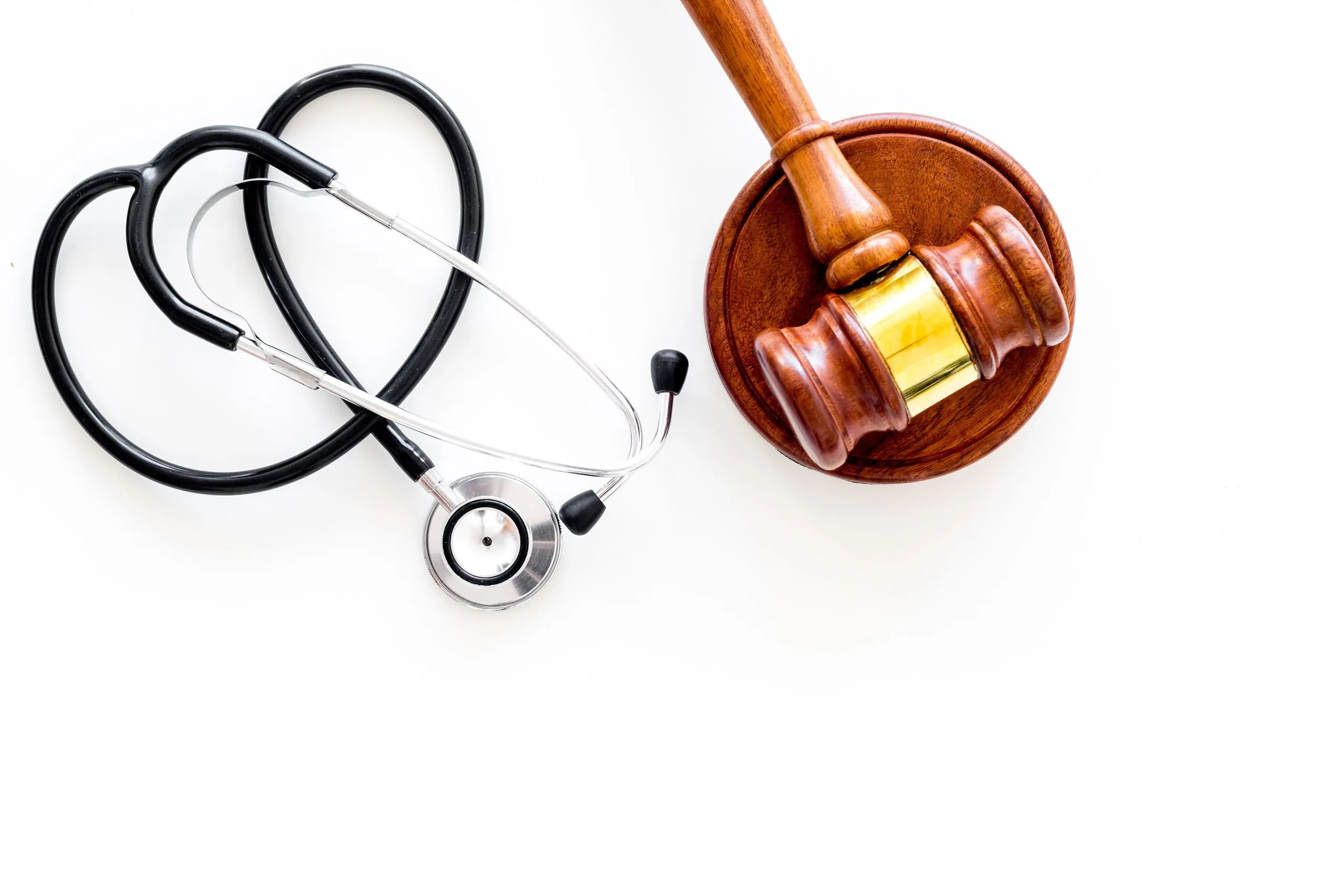 Doctor’s stethoscope and judge gavel. If you’ve sustained an injury in Kansas City, contact our personal injury lawyers today.