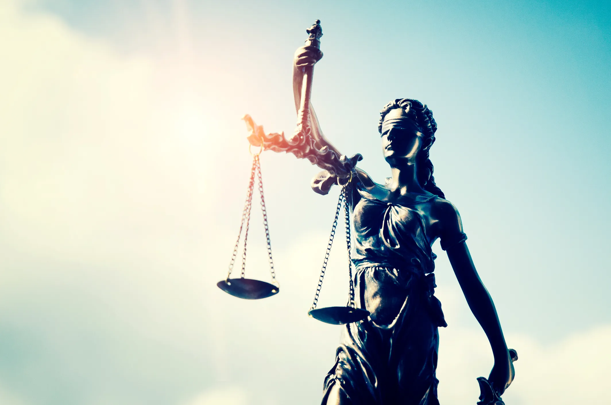 Statue of Lady Justice against the blue sky. Our criminal defense lawyers in Kansas City know that your personal freedom and future job opportunities are on the line if you’re facing DUI or drug charges and bring years of valuable experience to the table.