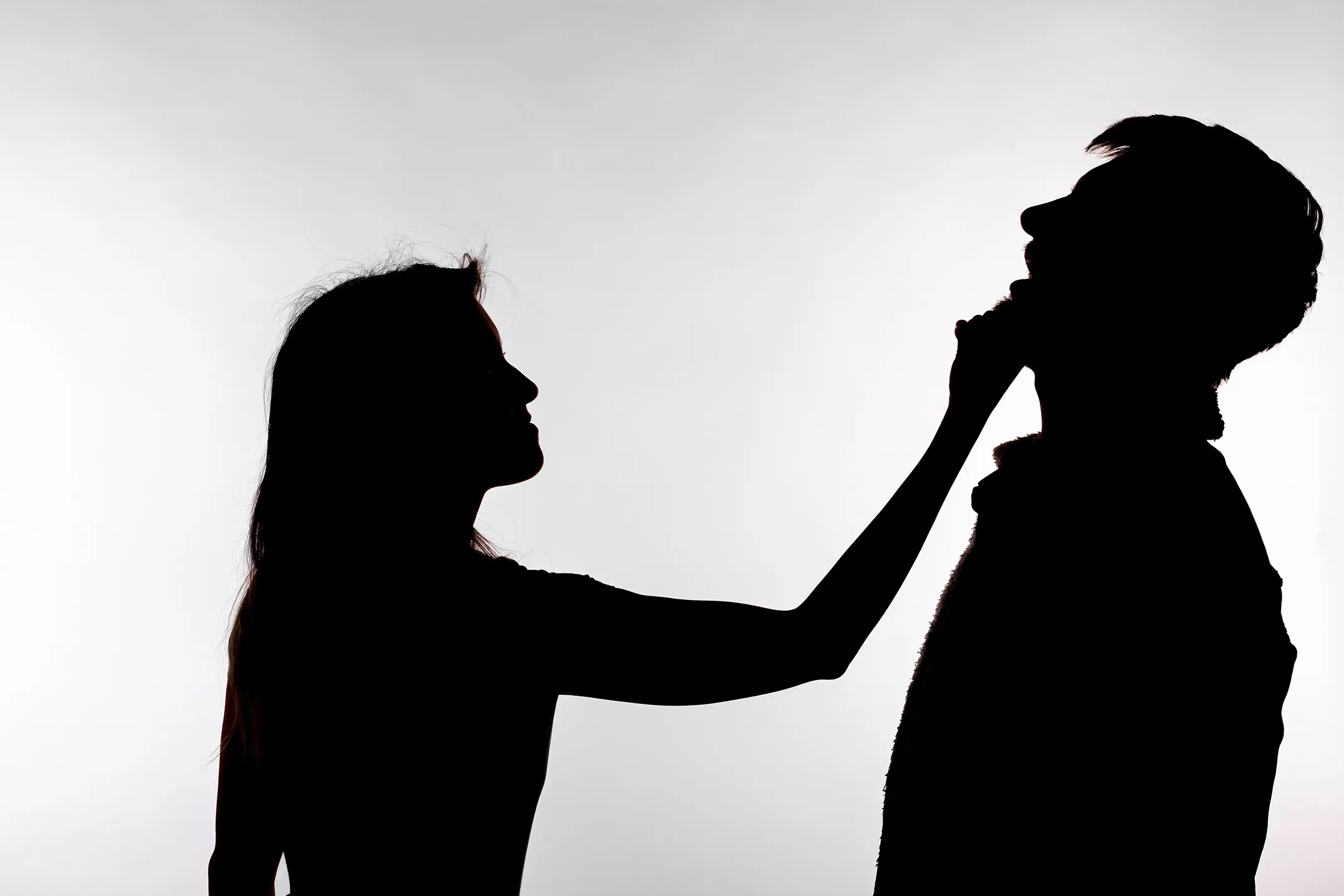 Man and woman in physical altercation. If you've been accused of domestic violence in Kansas City, contact our criminal defense lawyers immediately. 